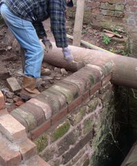 John puts the finishing touches to the end wall.